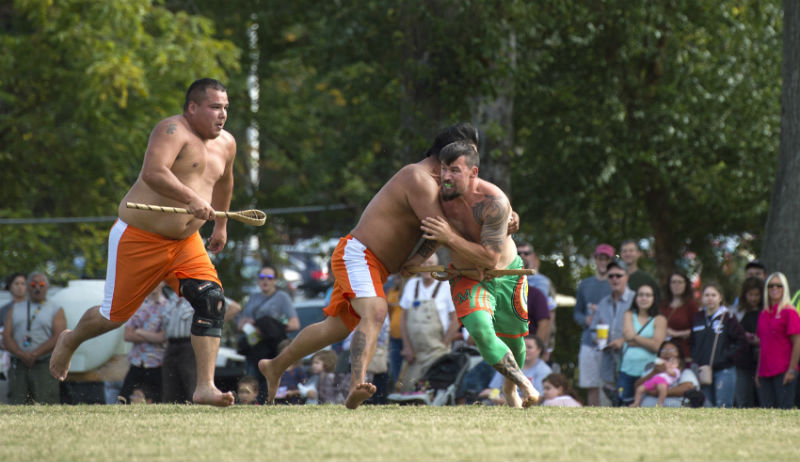Members of the Eastern Band of the Cherokee Indians playing stickball.
