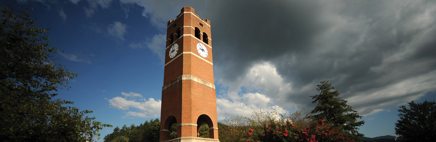 Photo of the Alumni Tower on campus as the background of a clickable button.