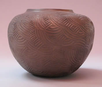Vessel with paddle-stamped surface