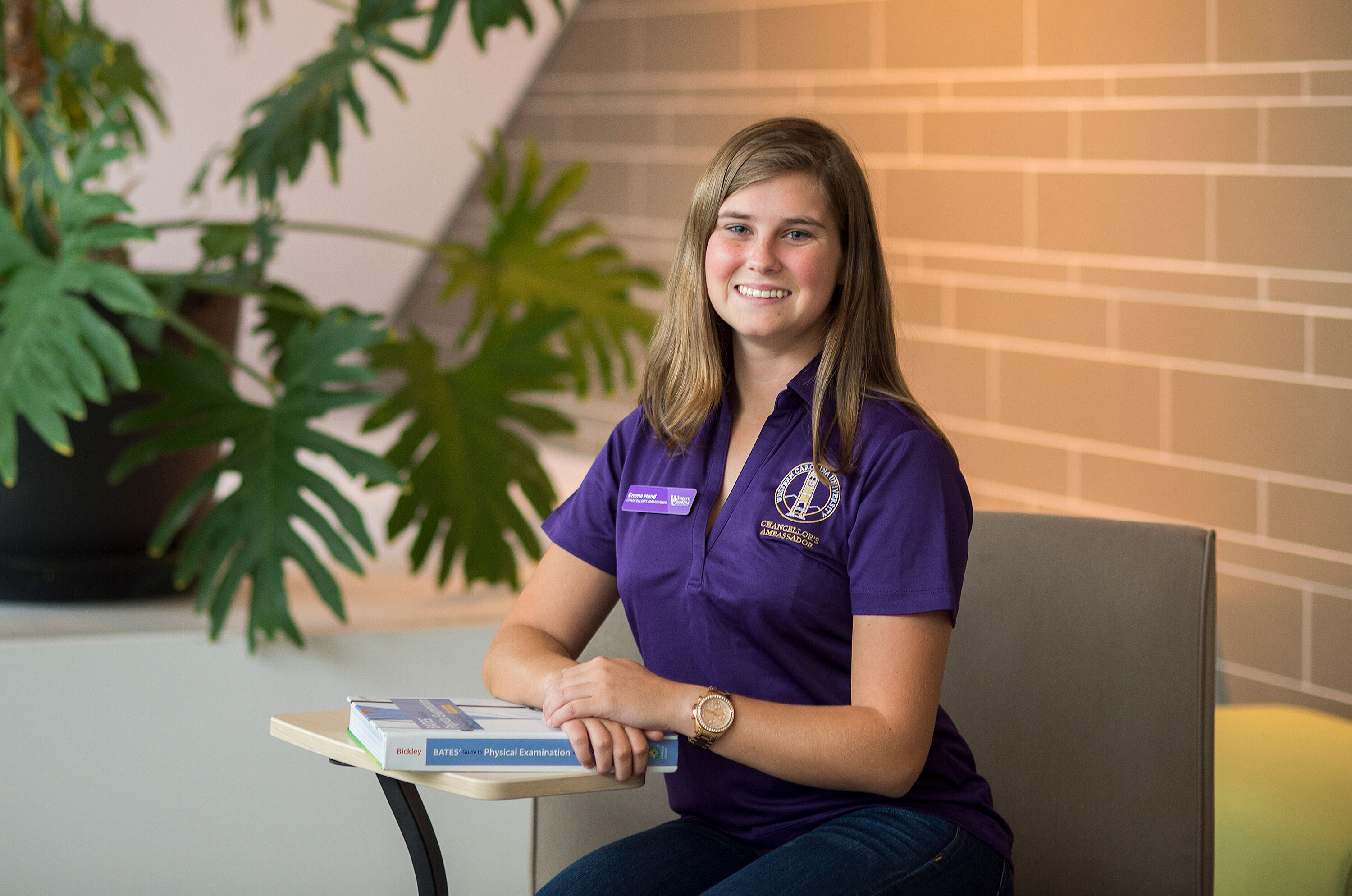 Graduate Emma Hand in the Health and Human Sciences Building