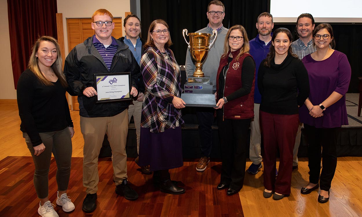 Representatives from the division of Athletics accepting their trophy at the I Love WCU celebration