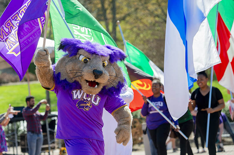 paws on campus with international flags