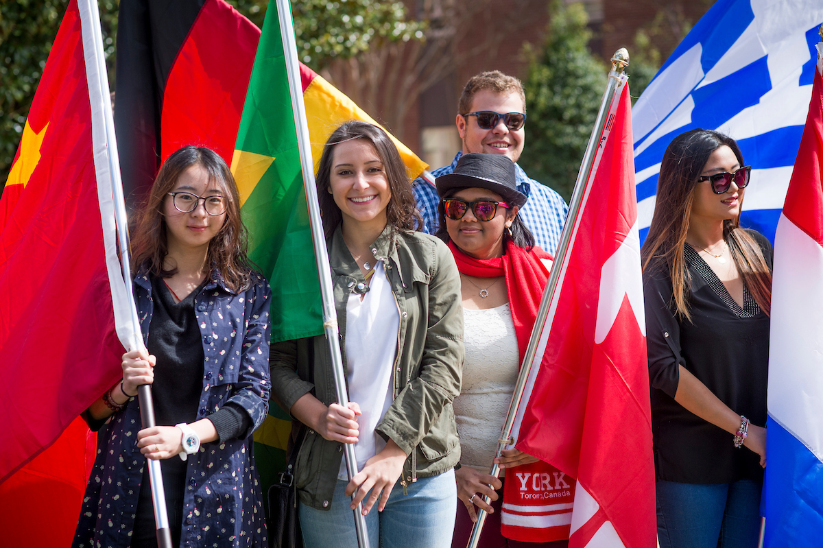 WCU students holding International Flags
