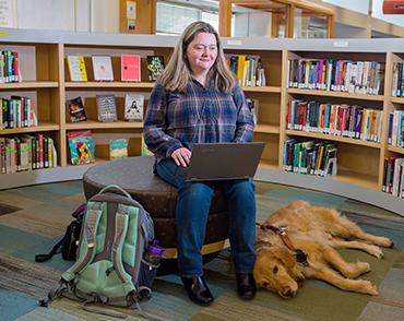 Student studying with assistive technology in the Library.
