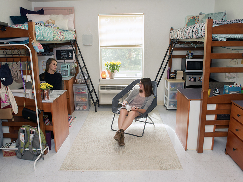 Two female students in their room in The Village