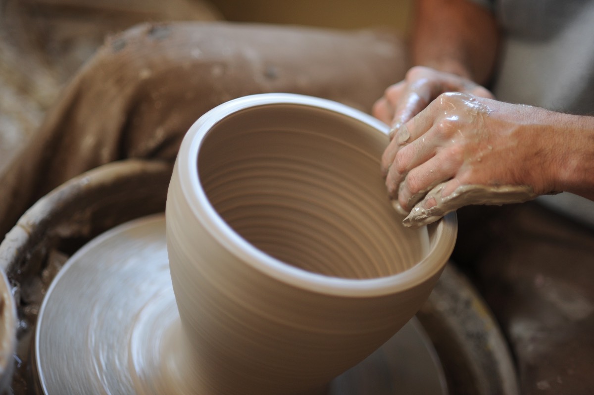 Someone creating a large bowl