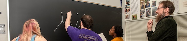 Faculty working with students