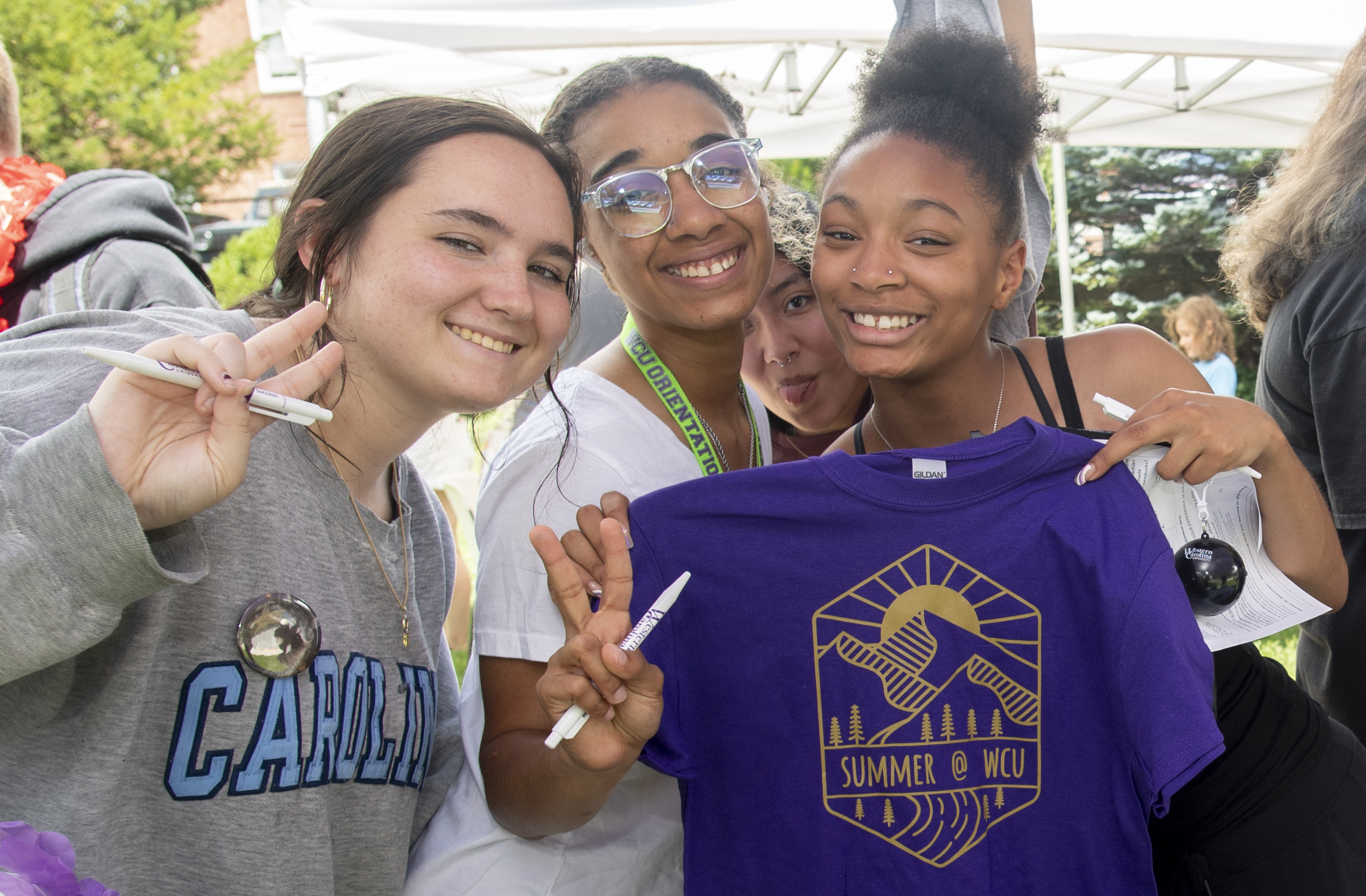 Students posing with Summer t-shirt