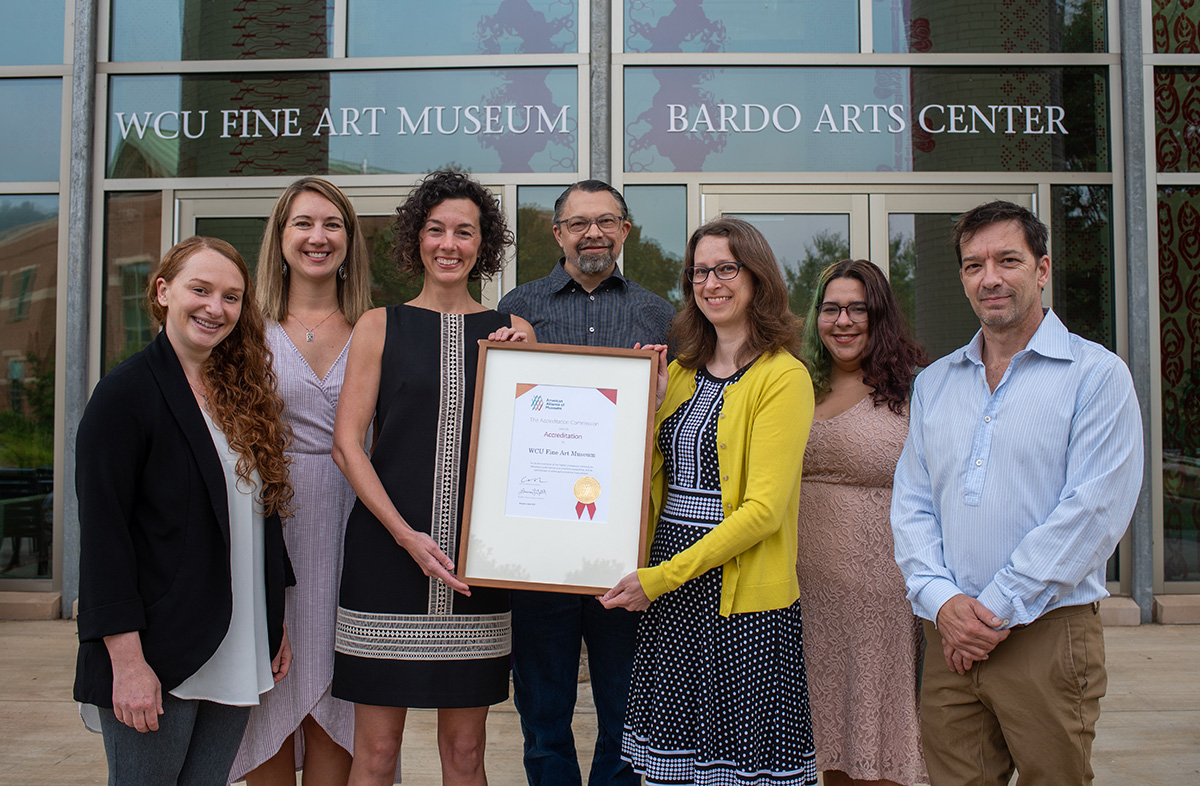 Bardo Arts Center Staff Holding American Alliance of Museums Accreditation Award