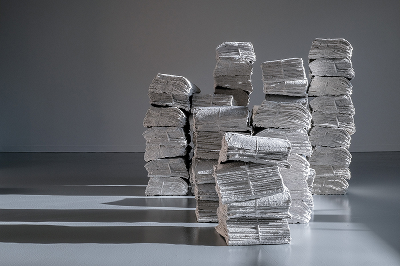 lydia see, Whitewashing the News, 2019-2020, newspaper, scrap paper, plaster mold dimensions variable.