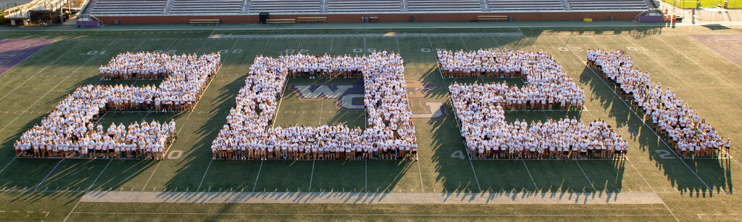 aerial photograph of the class of 2021 on the football field