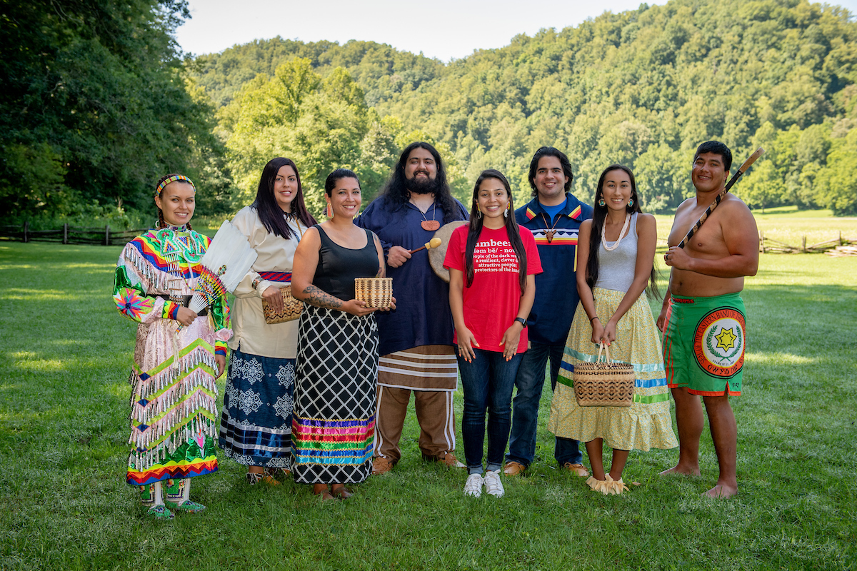 Students and staff of Cherokee heritage, dressed in traditional oufits