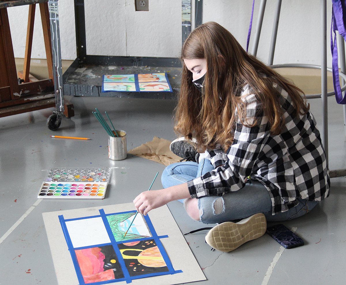 Teenage girl in studio at wcu painting