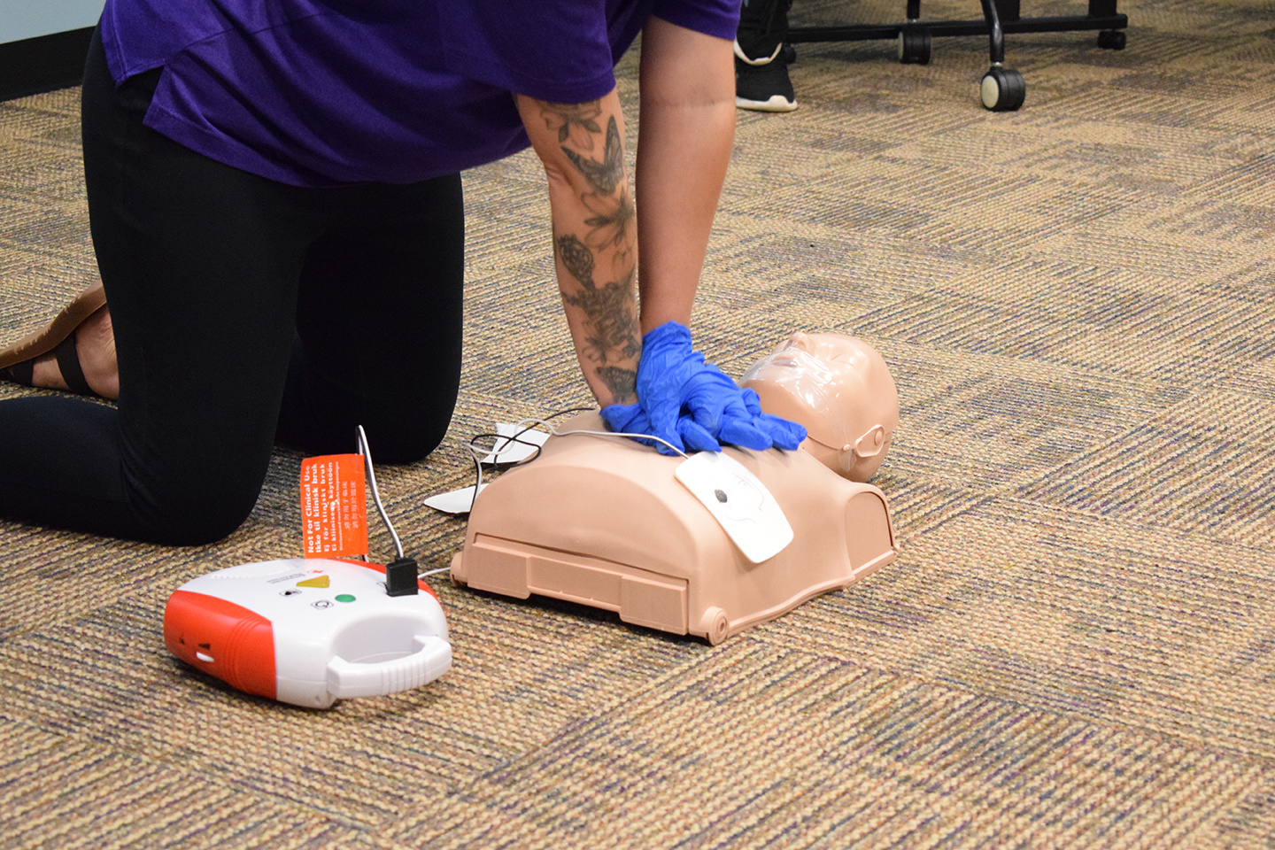 practicing on a cpr dummy