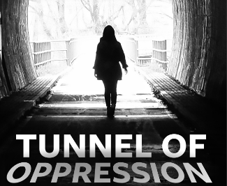 Tunnel of Oppression - person walking through a dark tunnel