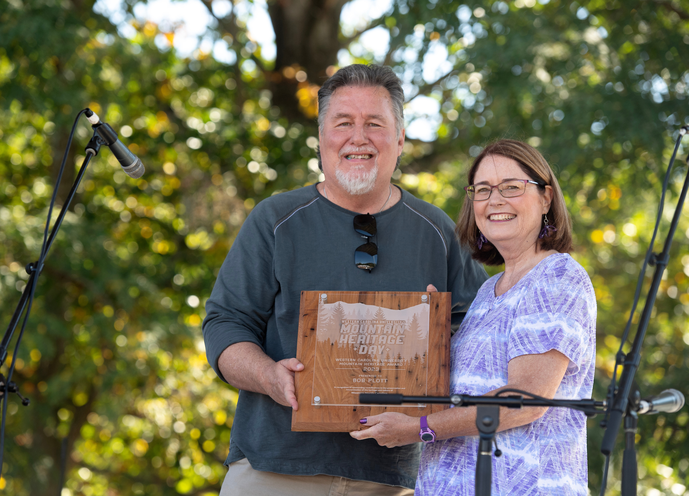Bob Plott receives award from Dr. Kelli Brown