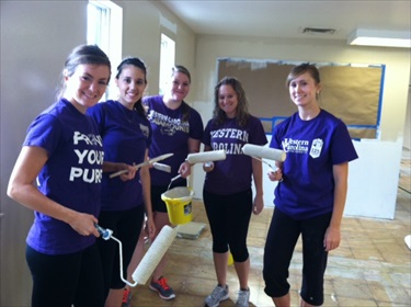 WCU students who volunteered to help transform a closed prison into a shelter, halfway house and soup kitchen help with painting at the Haywood Pathways Center during "WCU Flip the Prison Day" on Friday, Sept. 26.