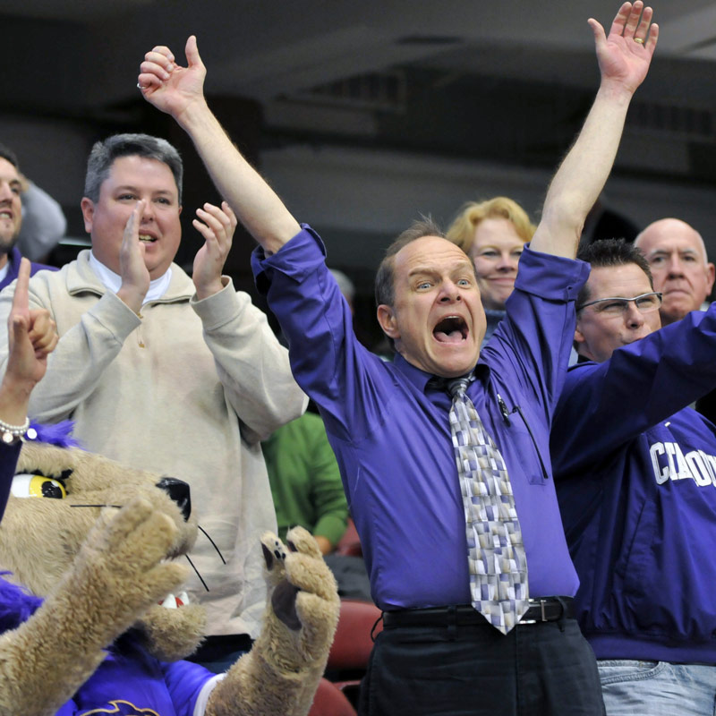 Dr. Belcher enthusiastically cheering on the Catamounts at a WCU basketball game
