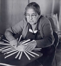 Lucy George begins to weave a basket tray