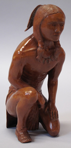 Carving of a crouching warrior