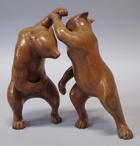 Carving of two fighting bears