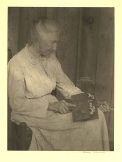 Woman carding wool