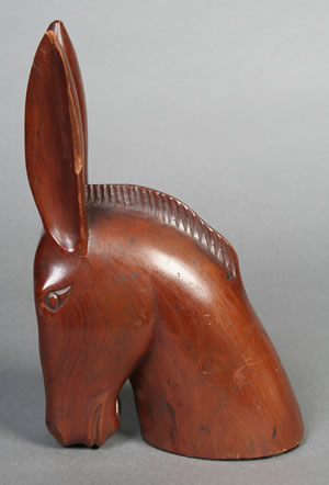 Mule head carved in walnut by Watty Chiltoskie. Mule and horseheads were his most popular carvings. Southern Highland Craft Guild.
